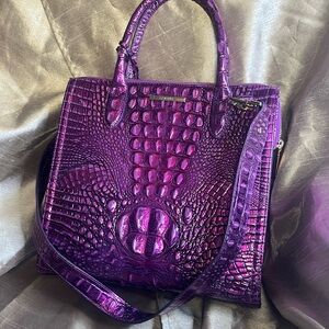 Purple, Metallic Embossed Leather.  Reselling due to cancellation.